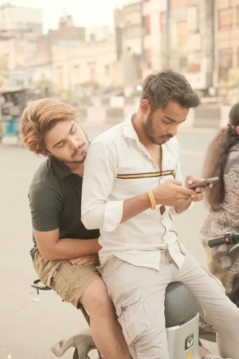 Two people looking at a phone together